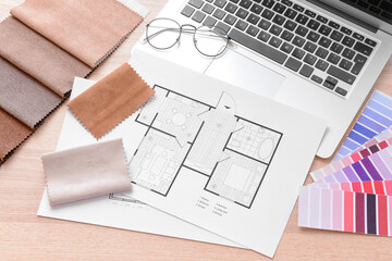 House plans, color palettes and fabric samples on wooden background