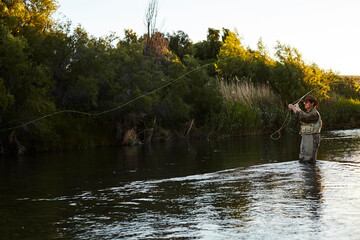 Fototapeta na wymiar Fishing in a river in patagonia.