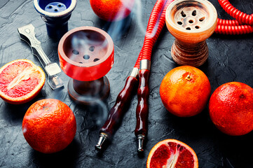 Traditional oriental hookah with orange tobacco