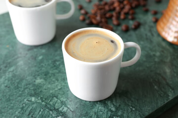 Cup of tasty hot coffee, closeup