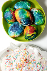 Beautiful bright colorful multi-colored cupcake and Easter eggs.