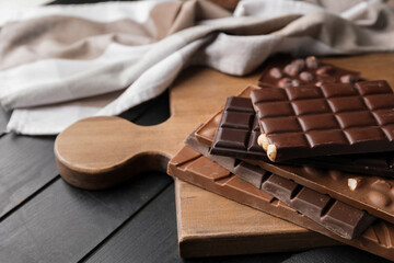Different chocolate bars on dark background
