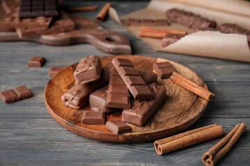 Plate with chocolate on dark background