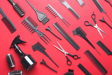 Set of hairdresser's tools on color background
