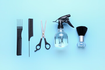 Fototapeta premium Set of hairdresser's tools on color background