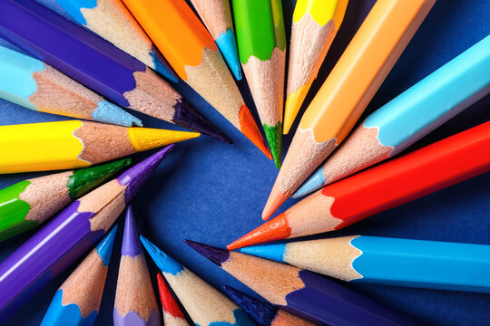 Composition with colorful pencils on color background