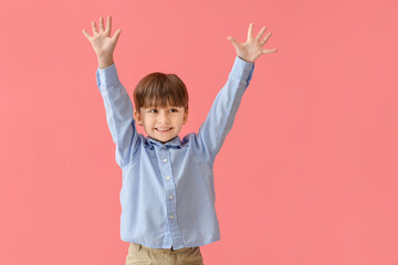 Cute little boy on color background