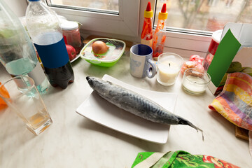 Mackerel fish thawed on the kitchen table