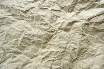 Top view photo of Crumpled craft paper. Paper background with copyspace. Vintage paper canvas texture abstract background.
