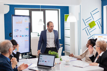 Mad nervous manager in briefing conferecen room screaming et multiethnic diverse employee asking for explications. Reprimanding unsuccessful results and rivalry concept.