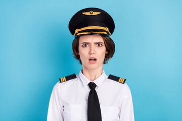 Photo of impressed nice brunette hair lady wear pilot uniform isolated on blue color background - obrazy, fototapety, plakaty