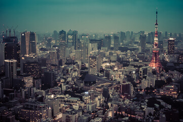 Tokyo Tower and urban skyline rooftop view at night, Japan.