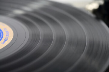 A close look at a black vinyl record, selective focus.