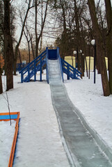 wooden children's slide with ice descent
