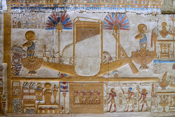 Wall Painitng from the temple of Osiris in Abydos, depiciting the sacred boat of the Sun God, on the lower register - kings, presenting offerings ot the gods. - obrazy, fototapety, plakaty