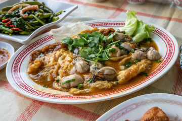 Oyster Omelette and vegetables on a plate