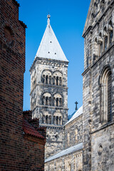 Fototapeta premium One of the steeples of Lund cathedral against clear blue sky on bright spring day