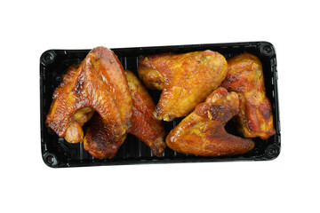 Container with baked chicken wings isolated on white background