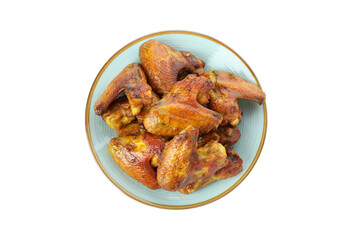 Plate with baked chicken wings isolated on white background