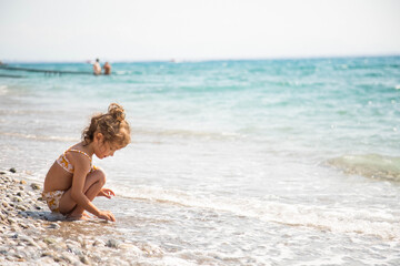 child playing on the beach