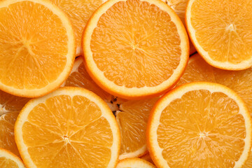 Slices of delicious oranges as background, closeup