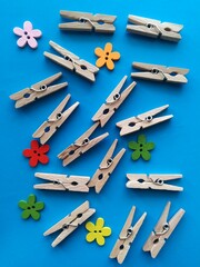 wooden clothespins on blue background