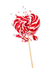 Broken heart shaped lollipop isolated on white, top view. Relationship problems concept