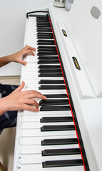 Fototapeta na wymiar person playing piano