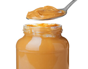 Taking spoon of delicious peanut butter on white background