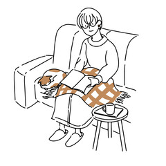 ソファでくつろぎながら読書するショートカットの女性と猫