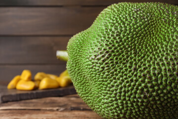 Fresh exotic jackfruit on wooden table, closeup