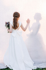 bride in white dress with bouquet