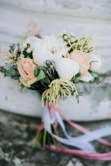 bridal bouquet of roses and peonies