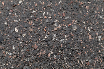 Wet road surface. Tarmac texture, dark road