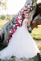 bride on the background of a decorated tree