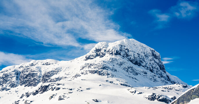 Spectacular view of a snow capped mount Bitihorn peak in Beitost&oslash;len in Norway on a sunny winters day.