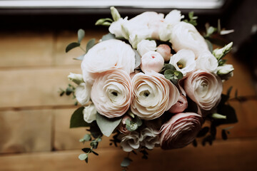 top view wedding bouquet of white roses and runculus