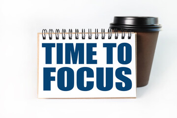 TIME TO FOCUS. Text on white notepad paper on light background