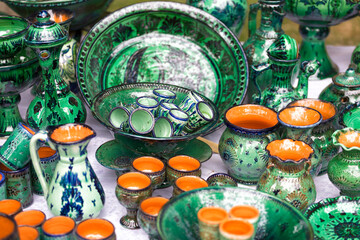 a bright set of Uzbek dishes - bowls, jugs and a large plate