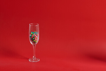 wine glass stands with round multicolored round chocolates