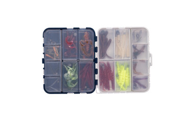 Transparent box with silicone fishing lures isolated on white background