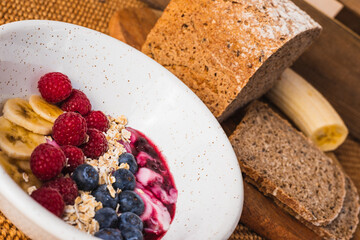 Close up healthy breakfast with a fruit bowl with yoghurt