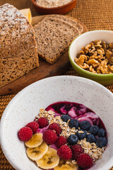 Close up healthy breakfast with a fruit bowl with yogurt
