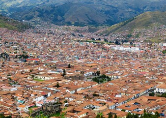 Cuzco old town in Peruvian Andes view. Cusco city acknowledged as  historic capital of Peru. Scenic aerial cityscape.