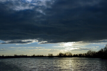 Fototapeta na wymiar lake water sunset sky river