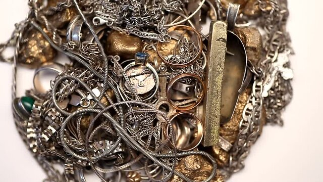 Pile of silver and gold jewelry rotating 4K