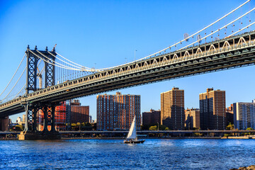 Manhattan Bridge in New York City. is a suspension bridge that crosses the East River in New York City, connecting Lower Manhattan with Downtown Brooklyn.