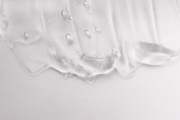 Skincare lotion face serum swatch. Gel smudge isolated on white background. Cosmetic cream...