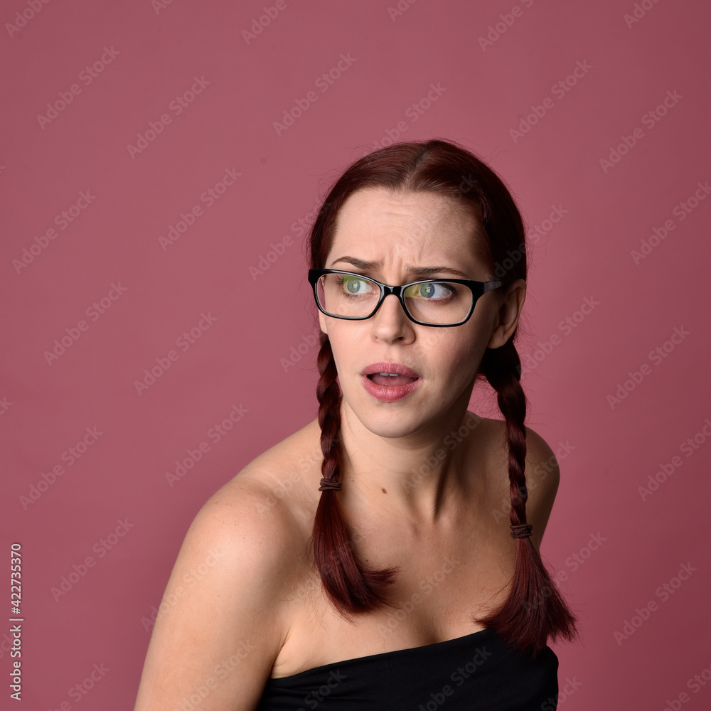 Sticker close up portrait of red haired women with different facial expressions on a pink studio background.