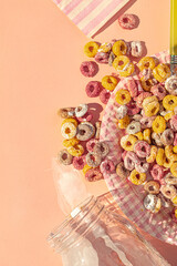 Top view of desastrous breakfast with colors cereals and milk